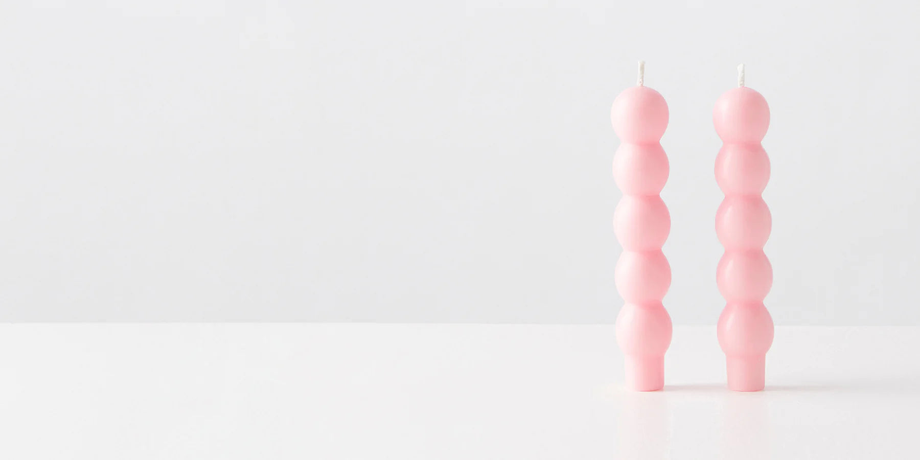 2 VOLUTE CANDLES PINK